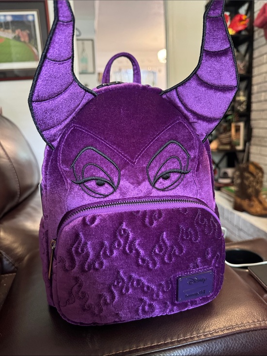 disney purple mini backpack Loungefly Mickey Ears Sequin Once Upon Magic over matching floral print and Minnies head as a sweet silhouette. Loungefly Disney Bambi Iridescent Convertible